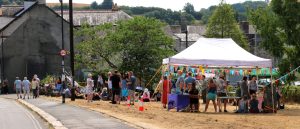 A distant shot of the Inauguration Festival at Cleder Place Ashburton with a gazebo in the foreground